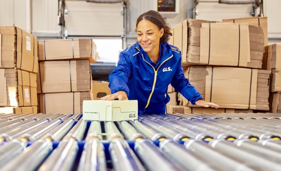 Employee in depot with parcel