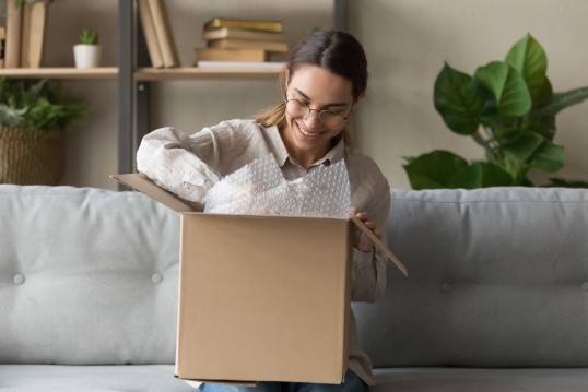 Woman-opening-a-parcel