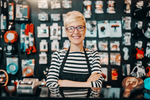 Smiling shop owner