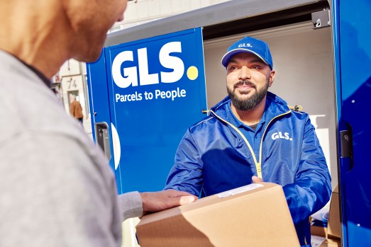 GLS deliverer hands over parcel